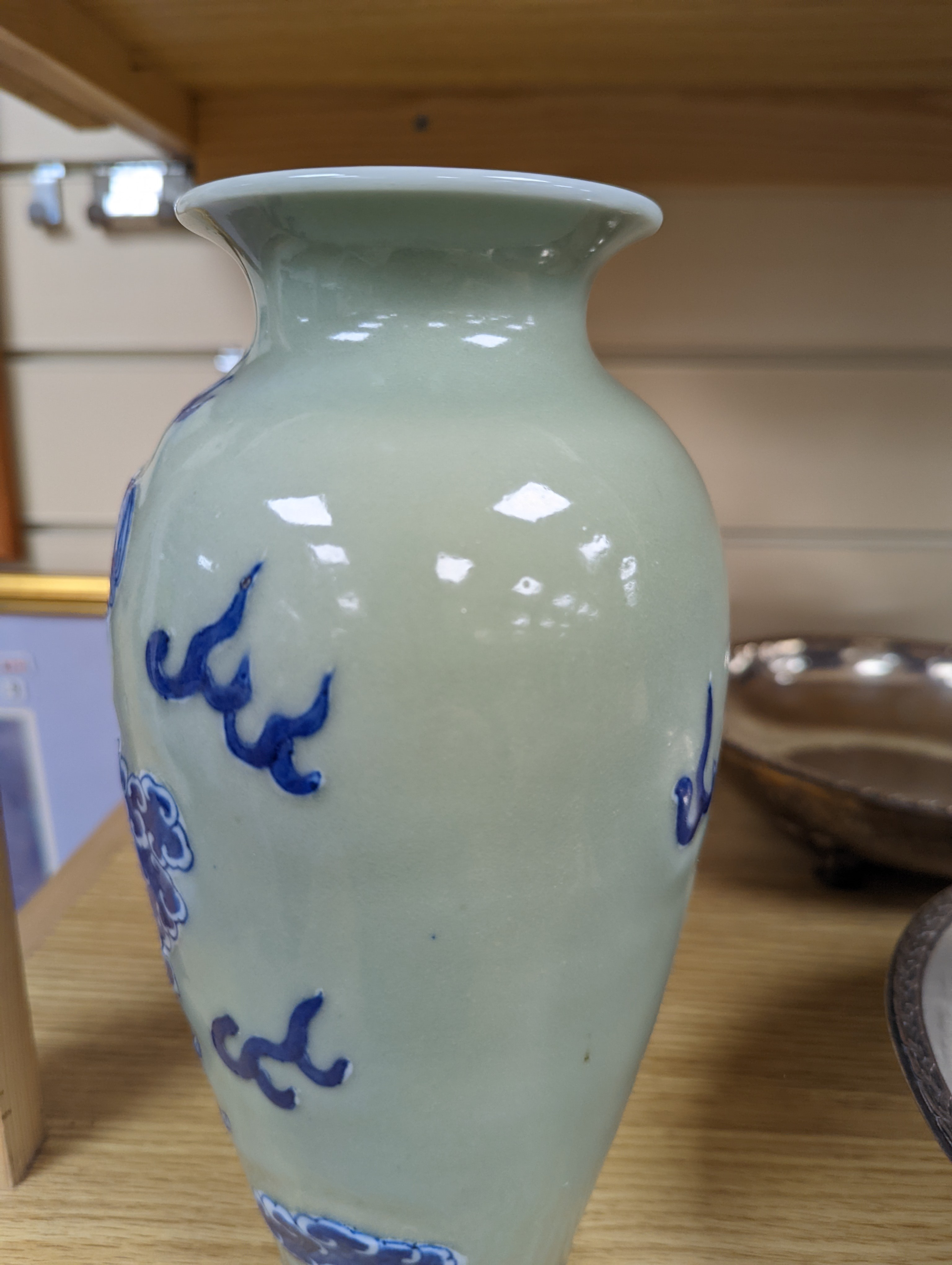 A Chinese celadon glazed vase, 24cm and a Chinese famille rose teapot and matching cream jug, a.f.